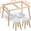 A wooden sensory table set with two white stools and two white storage bins, shown with dimensions indicated. Voir les images du produit