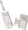A stainless steel mandoline slicer and three interchangeable blades are displayed against a white background. Produktbild-Vorschau