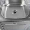 A close-up, overhead view of a stainless steel kitchen sink and the top of a cabinet with a drawer. Náhľad obrázku produktu