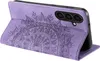 A purple phone case with a mandala design is shown standing upright. Produktbild-Vorschau