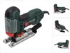 A Metabo STE 100 Quick Stichsäge jigsaw is shown against a white background. The jigsaw is green and black with silver and red accents. It is shown from a slightly elevated side angle. Podgląd zdjęcia produktu