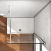 Top-down view of a shower enclosure with a white shower tray, glass panel, and wooden floor. Produktbild-Vorschau