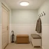 A hallway with a door, a bench, a chest, and coat hooks. Náhľad obrázku produktu