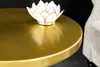 A close-up of a gold side table with a lotus-shaped candle holder on top. Produktbild-Vorschau