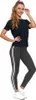 A woman is posing in athletic wear against a white background. Produktbild-Vorschau