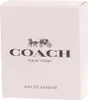 A light pink box with the Coach logo and text. Náhľad obrázku produktu