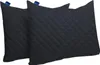 Two black quilted pillows are shown side-by-side against a white background. Produktbild-Vorschau