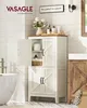 A white wooden bathroom cabinet with two doors at the bottom and a glass door at the top, filled with bathroom essentials and decorative items. A bathtub is visible to the left, and a wooden vanity to the right. Náhled obrázku produktu