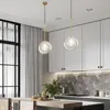 A modern kitchen with pendant lights over a counter. Anteprima dell’immagine prodotto