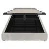 A bed frame with the mattress support lifted to reveal the storage space underneath. Podgląd zdjęcia produktu