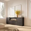 A modern living room with a sideboard featuring an electric fireplace, artwork, and a vase of yellow flowers. Produktbild-Vorschau