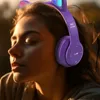 A young woman wearing purple cat-ear headphones with LED lights, looking to the side with her eyes closed. Náhľad obrázku produktu