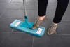 A person is using a mop on a tiled floor. Produktbild-Vorschau