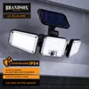 A solar-powered LED security light with multiple adjustable heads, mounted on a wall with rain falling. Produktbild-Vorschau