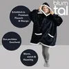 A woman wearing a dark blue hoodie blanket with white trim, holding up the hood. Produktbild-Vorschau