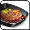 A grilled steak and potatoes on a grill pan. Podgląd zdjęcia produktu
