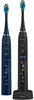 Two electric toothbrushes, one dark blue and one black, are displayed against a white background. The black toothbrush is placed on a charging base. Náhled obrázku produktu