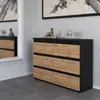 A modern dresser with six drawers in a black and wood finish, placed in a room with a mirror and artwork. Produktbild-Vorschau