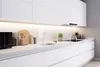 A clean, modern white kitchen counter with various kitchen accessories. Produktbild-Vorschau