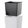 A black inner pot is shown being placed into a white textured outer pot. Náhled obrázku produktu