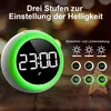 A digital alarm clock with a green illuminated ring is shown, with text and icons indicating its features. Produktbild-Vorschau
