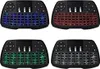 A collage of four backlit wireless keyboard and touchpad remote controls, each with a different color backlight. Produktbild-Vorschau