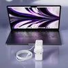 A laptop and its charger are displayed on a reflective surface. Produktbild-Vorschau
