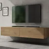 A modern, wall-mounted TV lowboard with a soundbar and a television above it, set against a textured concrete wall. Produktbild-Vorschau