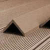 A close-up of a brown composite corner profile lying on a textured surface. Produktbild-Vorschau