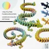A collage of 3D printed dragon figures in various colors, with text indicating multiple color options. Produktbild-Vorschau