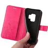 A hand is holding a pink flip phone case open, revealing the black interior where a phone would be placed. Produktbild-Vorschau
