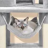 A cat is resting in a hammock on a cat tree. Produktbild-Vorschau