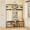 A hallway entryway with a multi-tiered coat and shoe rack. Shoes, bags, hats, and coats are displayed on the rack. Podgląd zdjęcia produktu