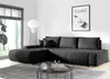 A modern living room with a black sectional sofa, a coffee table, and a large window. Náhled obrázku produktu