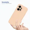 A hand holding a peach-colored phone case against a white background. Produktbild-Vorschau