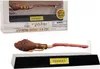 A Harry Potter levitating broomstick pen in its packaging and displayed on a stand. Produktbild-Vorschau