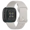 The back of a smartwatch with a light gray strap is shown against a white background. Produktbild-Vorschau