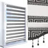 A product image showing two views of a roller blind with a Greek key pattern. Produktbild-Vorschau