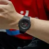A person wearing a black Casio G-Shock watch on their wrist. Podgląd zdjęcia produktu