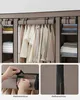 A collage showing a portable fabric wardrobe with clothes hanging inside and shelves with folded items. Close-up images show how the cover fastens and the zipper. Produktbild-Vorschau
