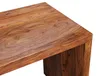 A close-up view of the corner of a wooden desk. Produktbild-Vorschau