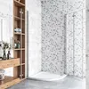 A modern bathroom with a corner shower enclosure, wooden shelving unit, and tiled walls. Produktbild-Vorschau