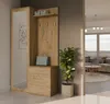 An entryway with a wooden cabinet and mirror, leading into a living room. Náhled obrázku produktu