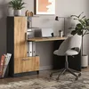 A home office setup with a desk, chair, laptop, and plant. Anteprima dell’immagine prodotto