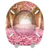 A toilet seat with a printed image of a pathway lined with trees and covered in pink blossoms. Náhled obrázku produktu