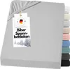 A folded fitted sheet with a tag attached.