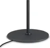 The base of a black floor lamp with a power cord extending from the left. Voir les images du produit