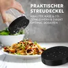 A hand is shown grating cheese onto a plate of pasta. The product is a grater with a dispenser lid. Podgląd zdjęcia produktu