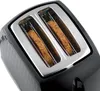 Close-up view of a black toaster with two slices of bread inside. Náhled obrázku produktu