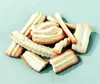 A pile of assorted cookies on a light blue background. Produktbild-Vorschau